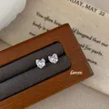 Minimalist 6mm heart-shaped clear zircon stud earrings in a silver finish - Four-Claw Heart Style / 6mm / Clear White