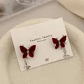 Elegant wine red velvet bow earrings with small silver butterfly pendant charms - Cool And Glamorous Butterfly (RV23)