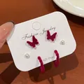 Dark red velvet bow earrings set with pearls and silver posts on display card - Butterfly Pearl Heart Earrings (VQ4)