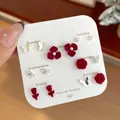 7-pair set of burgundy flocked floral and pearl stud earrings on a weekly card display - Red Rose Bow Pearl Earrings (US2)