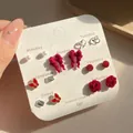Velvet bow earring set with 7 pairs of red and silver studs on daily display card - Bow Wave Heart Pearl Earrings (US9)