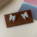 Silberne Schmetterlings-Ohrstecker mit blauem Stern und funkelndem rosa Zirkonia - Blauer Stern Schmetterling Ohrstecker (BH1) / Blau