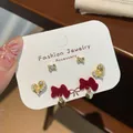 Three-pair red velvet bow and pearl heart earring set with gold accents - Butterfly Heart