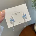 Elegante silberne Schmetterlingsohrringe mit blauen Katzenaugensteinen und Quasten - Blau Schmetterling Katzenaugen Hänger (HDW002)