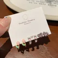 Three-pair earring set with pink tulip enamel designs and heart crystals on a white card - Heart Ear Clip (AZY2)