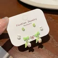 Three-pair floral earring set featuring pink tulips, green beads, and ribbon bows - Tulip Pendant (SDE2)