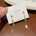 Long tulip drop earrings with purple crystal stud and white enamel flower detail - Cherry Green Leaf (FA2)