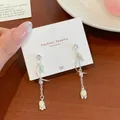 Long tulip tassel earrings with yellow enamel flower buds and green leaf charms - Light Green Tassel (YJXW2)