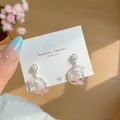 Pink butterfly and pearl dangle earrings with flower studs on a jewelry card - Pink Dreamcatcher (BM1)