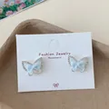 Sweet silver bow earrings with light blue fabric and sparkling zircon accents - Blue Butterfly Bowtie