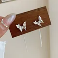 Silver bow-shaped long tassel earrings featuring delicate pleated metal butterfly design - Silver Butterfly Tassel Earrings