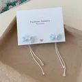 Sweet light blue ribbon bow earrings with silver tassels and sparkling zircons - Blue Double Tassel Bowtie