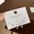 Three-pair silver earring set with stars, crystal hoops, and pearls on display card - Silver Star Pendant Set (YTZT004)
