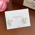 Elegant silver-blue flower stud earrings with white pearl and rhinestone detail - Blue-White Artificial Pearl Four-Petal Flower (YRH5)