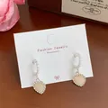 Pink heart drop earrings with shimmering crystals and elegant pearl accents on display - Pearly Pink Artificial Pearl C-Hoop (YRH8)
