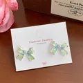 Blue gradient enamel bow earrings with center pearl on white display card - Blue-Green Artificial Pearl Bowknot (YRH10)