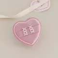 Silver bow tassel earrings with pearls displayed in a pink heart-shaped velvet gift box - Lace Bow
