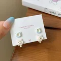 Cute cartoon earring set featuring blue donut and pink fruit designs on jewelry card - Melting Bear (XRT9) / 2 Pairs Set / Pale Blue
