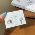 Cute asymmetric watermelon girl stud earrings with pink star drop on a display card - Pink Headphone Girl (XRT5) / Pink