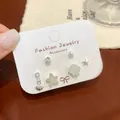 Set of 6 ocean themed silver earrings with gradient starfish and pearls on display card - Blue White Ocean Crystal Set