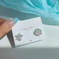 Asymmetric starfish and shell earrings featuring pastel green and pink resin inlay - Crystal Starfish Shell