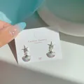 Starfish and shell earrings with purple gradient pendants on a display card - Purple Green Shell