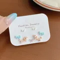 Cute dotted dachshund and blue bow stud earring set on display card for women - Dachshund Blue Bow Stud Style