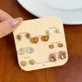 7-day variety pack of tortoise shell leopard print stud earrings on display card - Chicken Leg Cat Paw Style