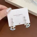 Sky blue enamel rocking horse earrings with silver base and sparkling white zircon detail - Blue Merry-go-round (MRC2)