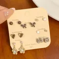 7-day leopard print earrings set with bear patterns and heart studs on a display card - Croissant Cat