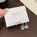 Three-piece silver earring set with white pearls, zircons, and blue heart charms - Heart And Round Ball Style
