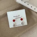 Elegant cherry red bead earrings with silver teardrop pendants on white jewelry card - Large Red Bead Pendant (REW4)