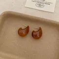 Vintage amber resin stud earrings in a rounded comma shape for classic chic style - Maillard Brown Coffee