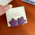 Vintage red and blue plaid star-shaped fabric studs on jewelry display card - Blue Red Plaid Star