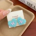 Cute light blue fuzzy heart studs with pink bow accents on white display card - Blue Bow Heart
