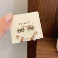 Three pairs of cute brown bow and rabbit earrings set on a cream display card - Zirconia Pearl Rabbit (QDT5)