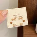 Three-pair set of cute brown bear and heart stud earrings on a fashion jewelry card - Heart Bow Bear (QDT8)