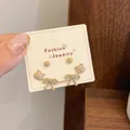 Three-pair cute bear and bow stud earring set in milk tea brown finish on display card - Brown Bear (LJT1)