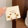 Three-piece brown panda and heart earring set on display card with matte chocolate finish - Bow C-Ring (LJT2)