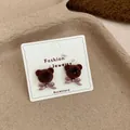 Brown flocked teddy bear stud earrings with pink bow on display card - Bear Head with Bowtie / Coffee