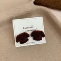 Cute brown flocked teddy dog stud earrings displayed on a white fashion jewelry card - Cute Puppy / Coffee