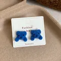 Cute dark blue flocked bear stud earrings on a white decorative display card - Lazy Bear / Blue