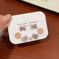 Beflocktes Weihnachtsmann-Schleifen-Ohrring-Set mit rosa-grauer Samttextur für Weihnachten - SDT15 Bogen Mondkuchen