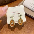 French vintage amber resin tulip earrings with golden bow detail and silver needles - Oval Tulip Pendant (UJ9)