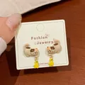 Cute calico cat stud earrings with yellow star charms on a white jewelry card - Orange Cat with Star Pendant (KTW42)