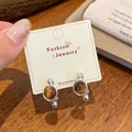 French vintage silver stud earrings featuring round brown tiger eye stone on display card - Silver Amber Round Ball (UJ6)
