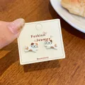 Cute calico cat stud earrings with cartoon oil drip design on fashion display card - Cute Spotted Cat (KTW46)