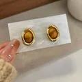 French vintage amber tiger eye stud earrings in gold frame on display card - Oval Imitation Stone Studs (HYS2)