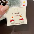 Cartoon snowman stud earrings with red hat on display card for Christmas jewelry collection - Red Scarf Christmas Snowman