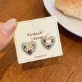 Cute heart-shaped brown puppy cat earrings with blue trim on a jewelry card - Leopard Heart Cat Head (KTW50)